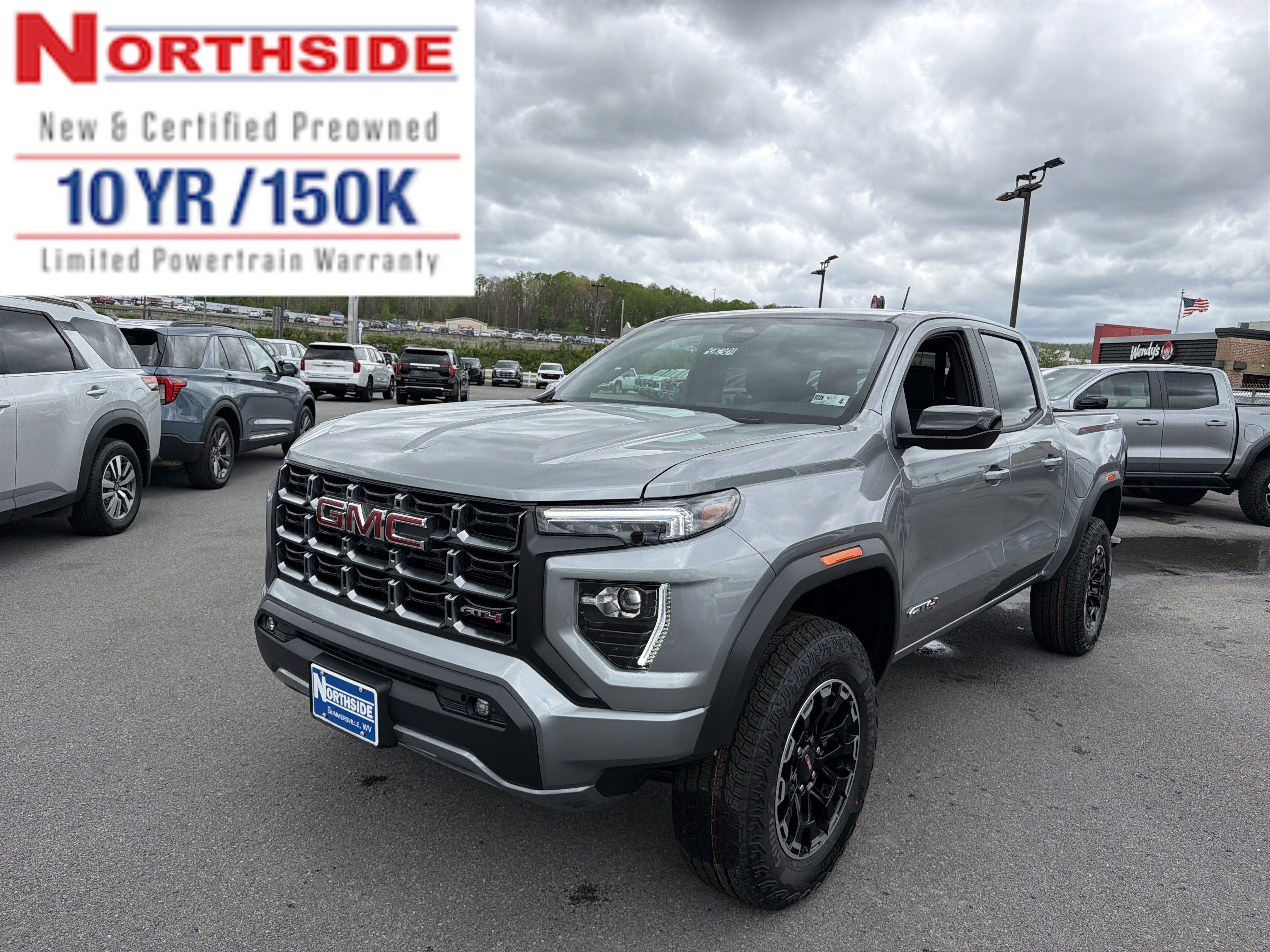 2026 GMC Canyon AT4 in Sterling Metallic — front three-quarter view
