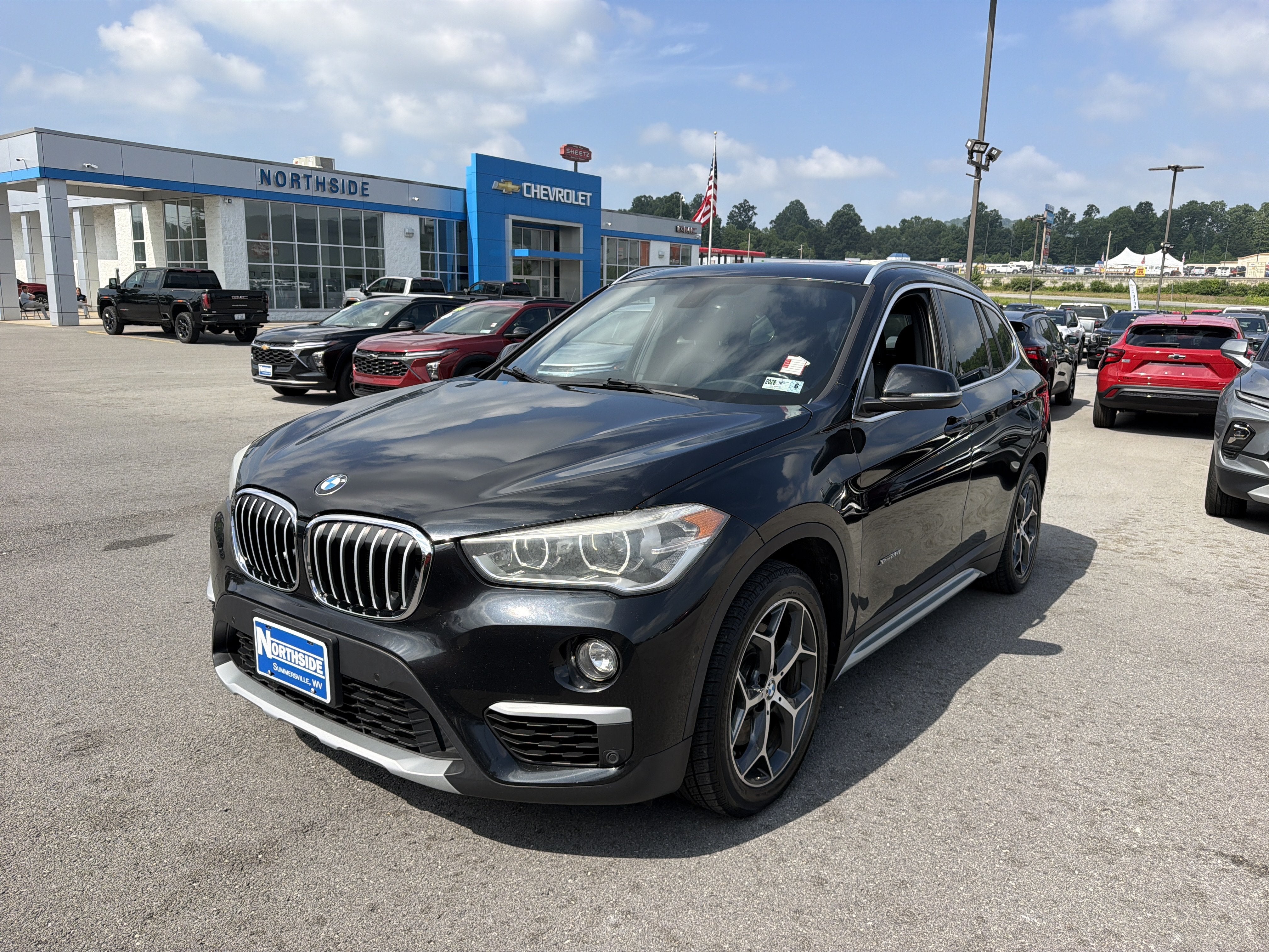 2017 BMW X1 xDrive28i in Black — front three-quarter view