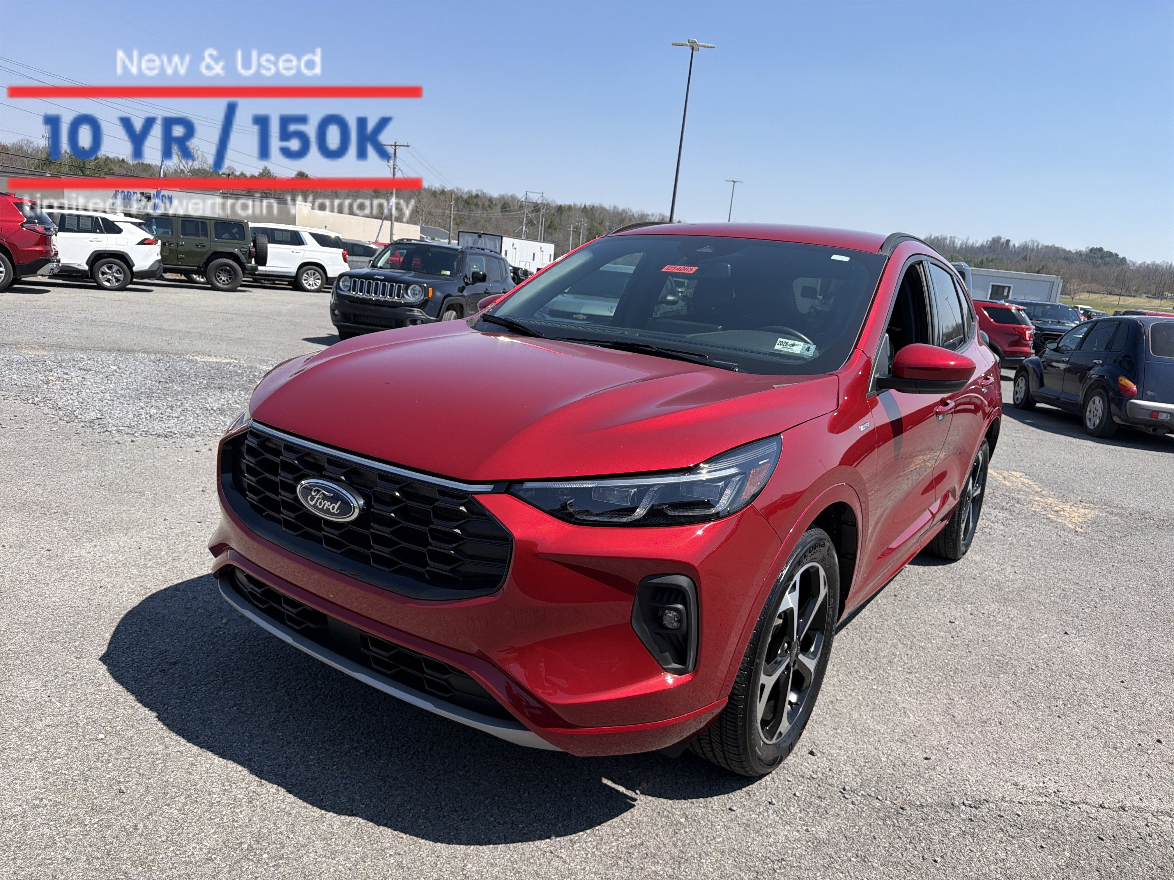 2025 Ford Escape ST-Line Elite in Red Metallic — front three-quarter view