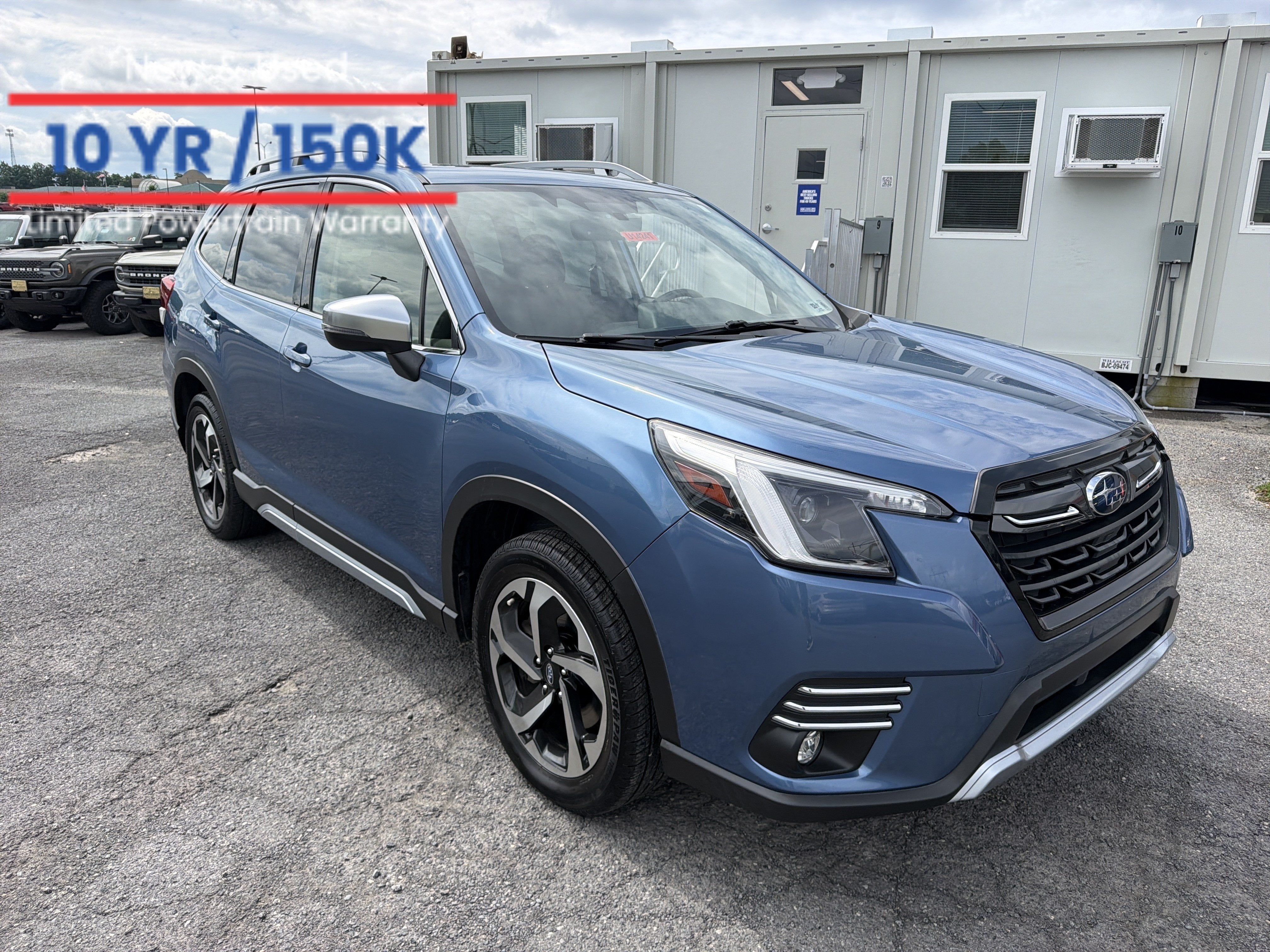 2022 Subaru Forester Touring in Horizon Blue Pearl — front three-quarter view